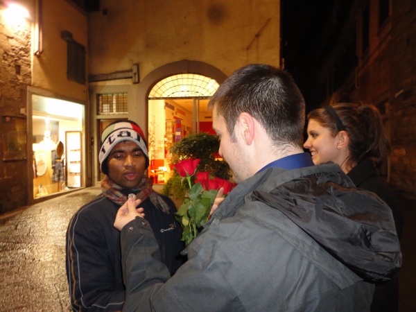 Weston buying a single rose on a night out in Florence